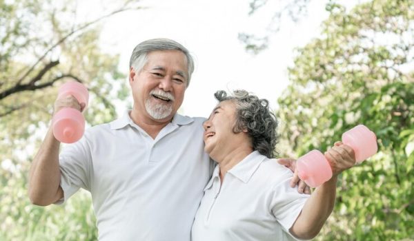 cheerful-elderly-man-senior-woman-with-dumbbell-workout-park-they-smiling-with-good-healthy-together_928174-4157